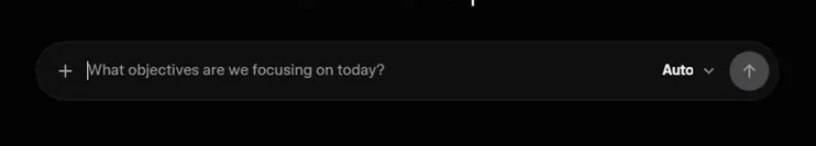 The Grok chat box: a field reading What objectives are we focusing on today?, a plus button on the left, the mode selector set to Auto and the send arrow on the right.