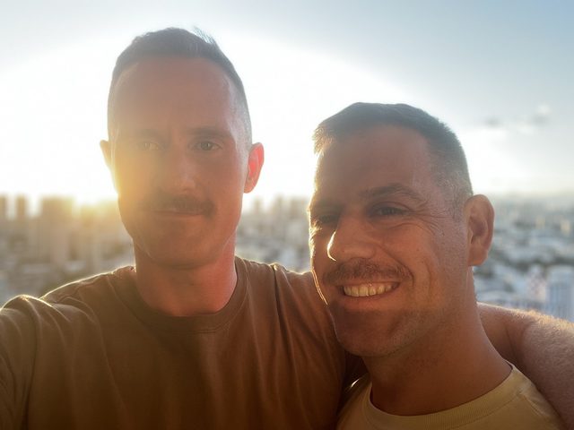 Sean and Dave at sunset above a city