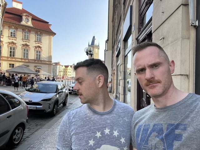 Sean and a friend on a street in an old town